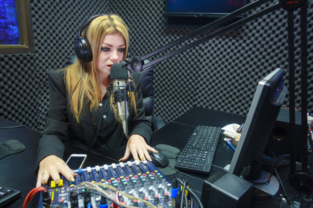 Beautiful Woman Recording Sound In Media Studio